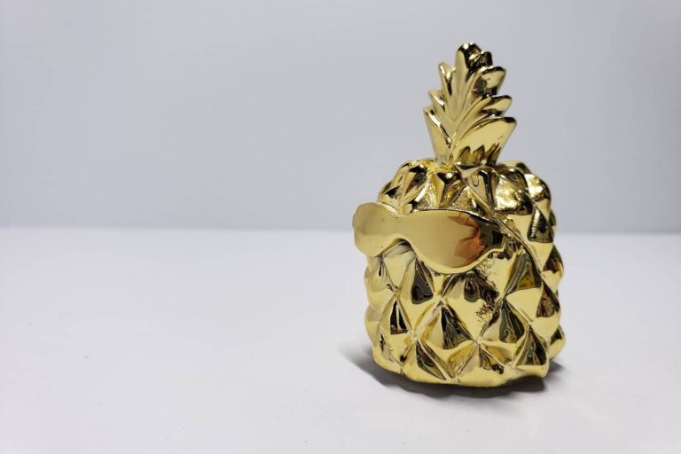 Golden pineapple with sun glasses on it